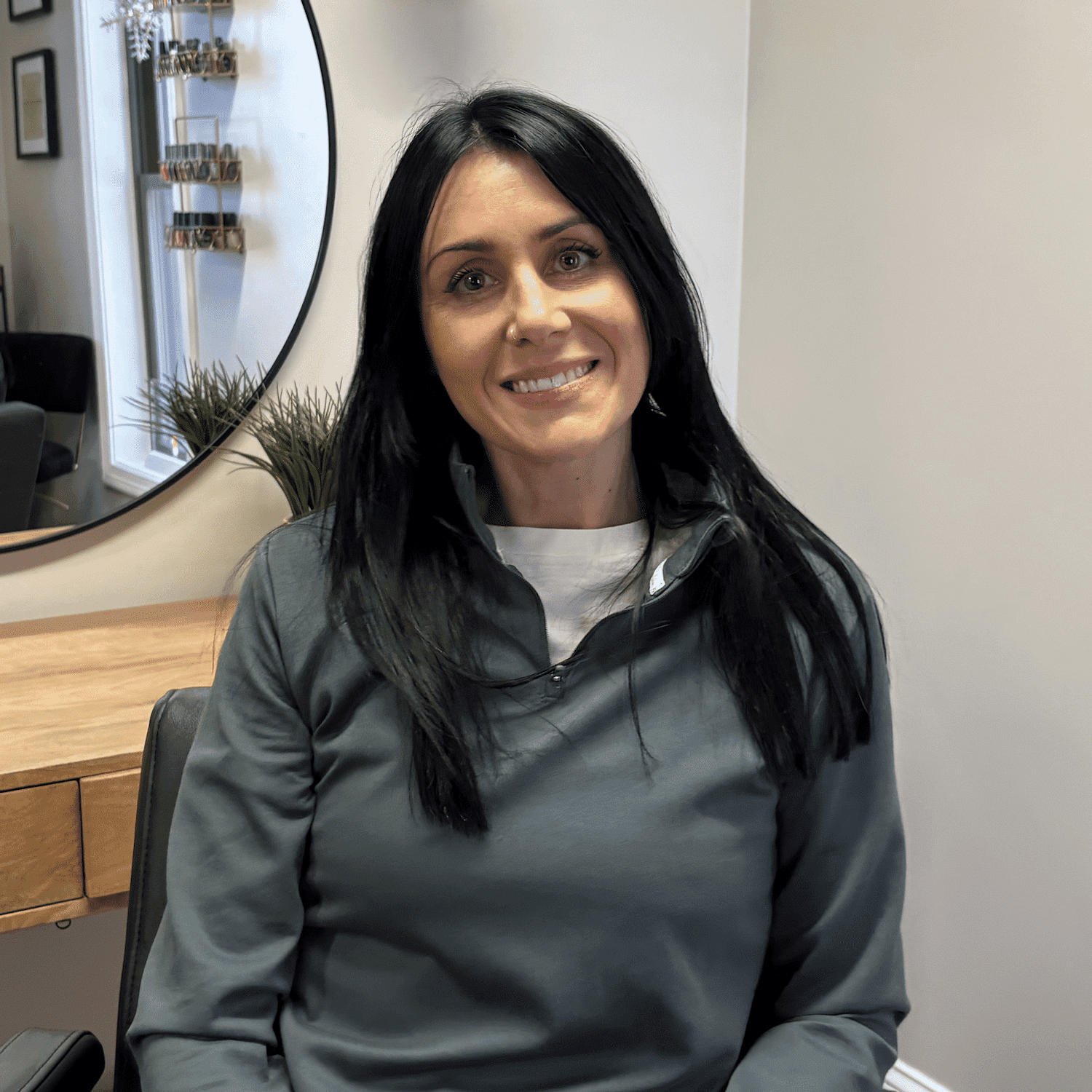 Portrait of Krystyna's Studio, a professional stylist at Integrity Hair Studios, showcasing their expertise and style.